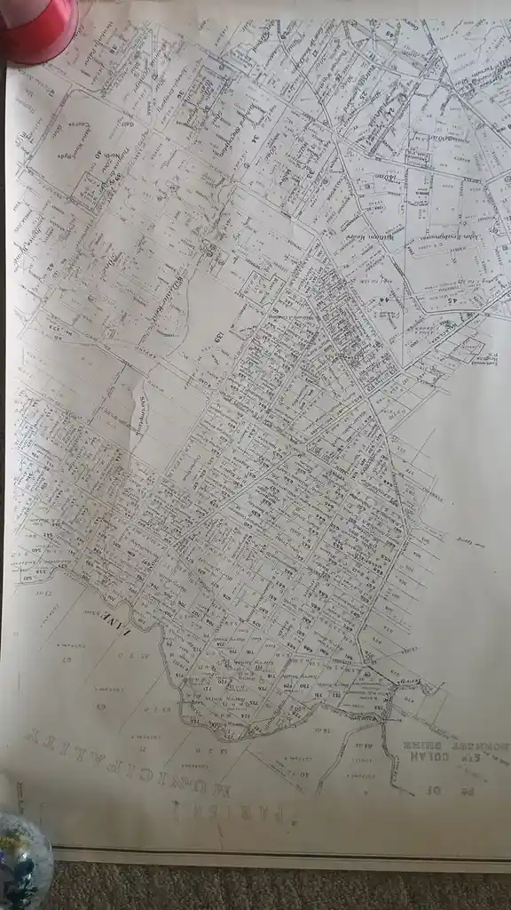 A close-up photograph of an old, detailed land survey map of the Colah Parish in Hornsby Shire, Australia, showing property…