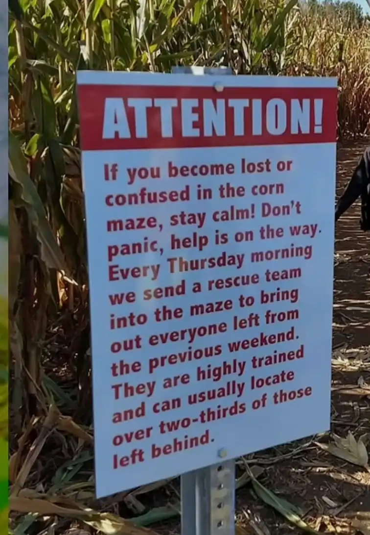 A sign in a cornfield warns visitors that if they become lost in the corn maze, they should stay calm because a rescue team…