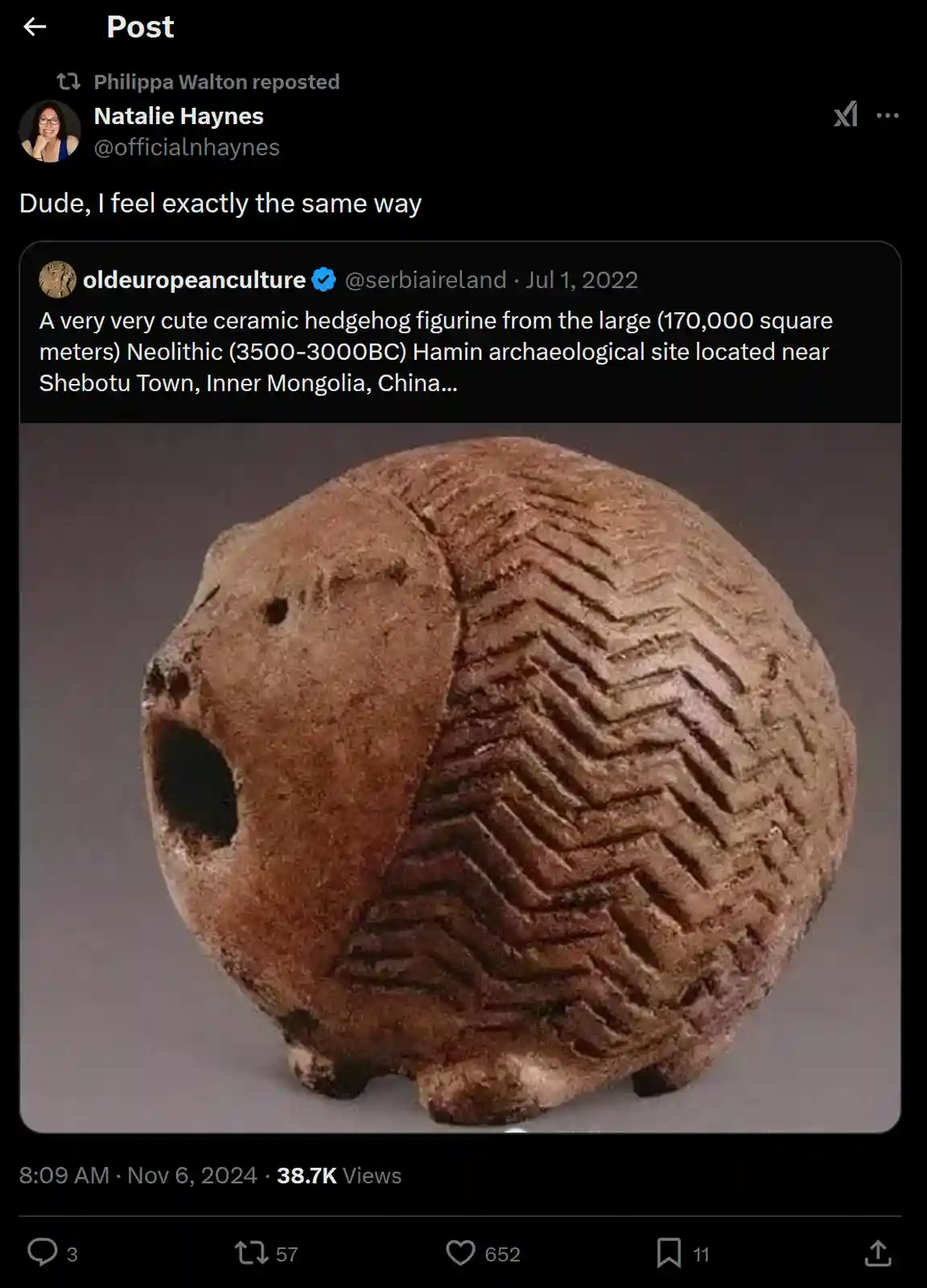 A reposted tweet shows a photo of a round, brown ceramic figurine with zigzag patterns on its back and a large hole on its…