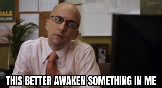 A bald man with glasses and a pink shirt and tie sits at a desk, looking skeptical and slightly annoyed. Behind him is a…