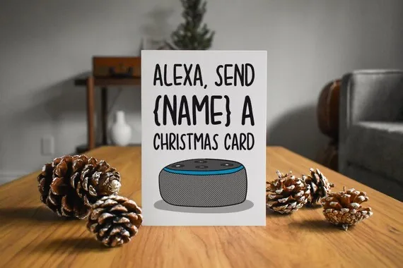 A printed card on a wooden table surrounded by pinecones, featuring a cartoon illustration of an Amazon Echo smart speaker…