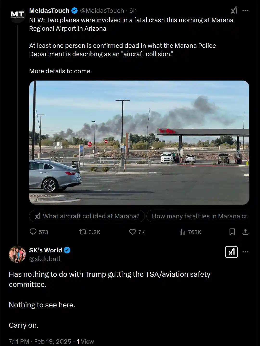 A screenshot of a tweet showing a photo of black smoke rising in the distance behind a gas station, with the tweet's text…