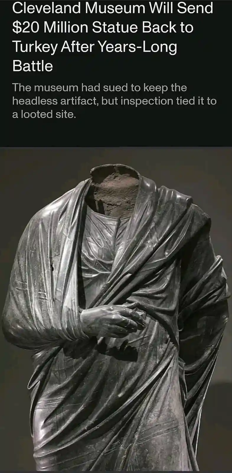 The image shows a headless, ancient-looking statue draped in fabric, with a dark background. Overlaid text announces that…