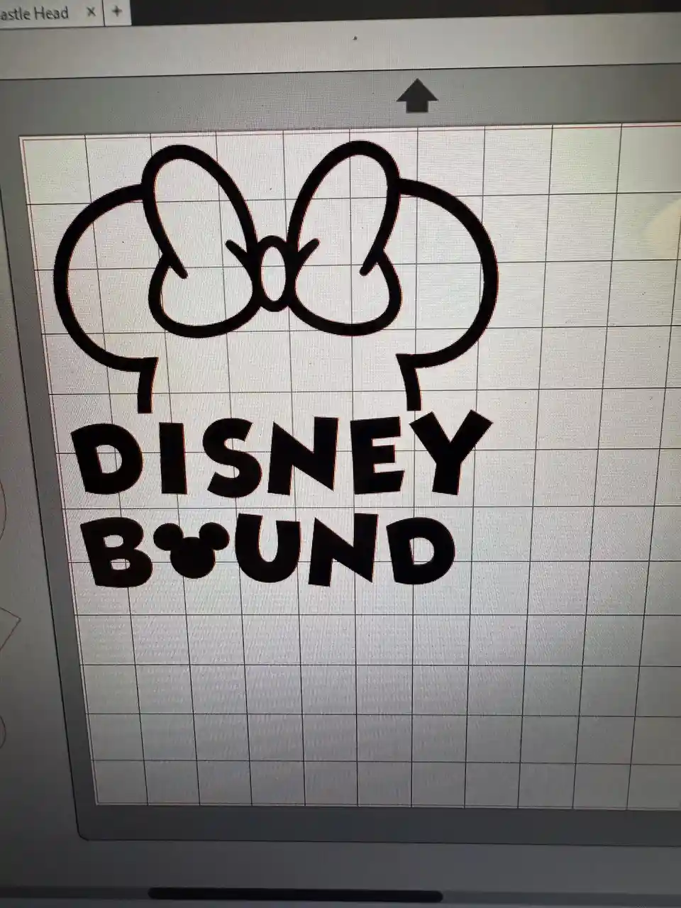 A computer screen displays a black outline of a bow above the words 'DISNEY BOUND' on a grid background, likely from a…