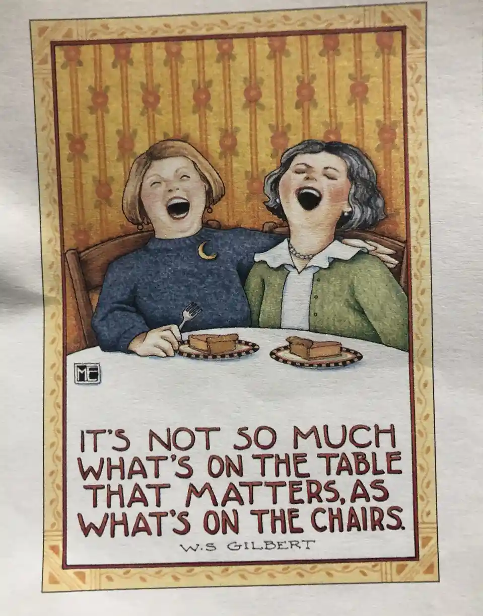 An illustration shows two women laughing heartily while seated at a dining table with small plates of food. The text…