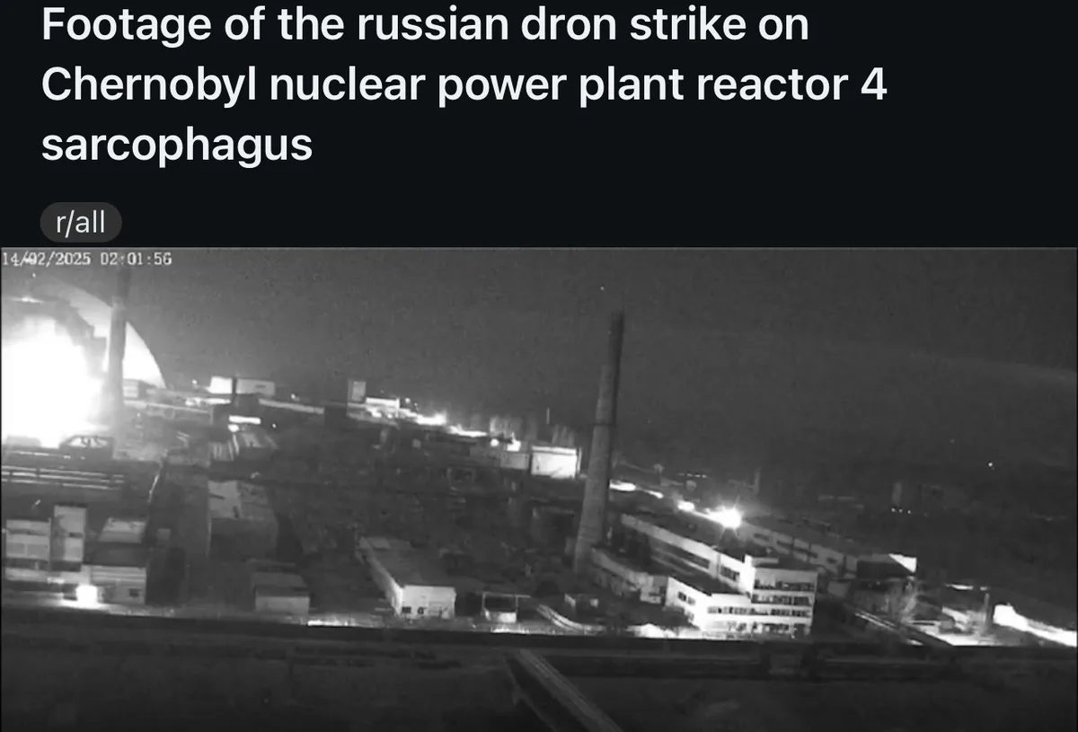 A grainy, black-and-white night-time security camera view shows the Chernobyl nuclear power plant, with a bright flash of…