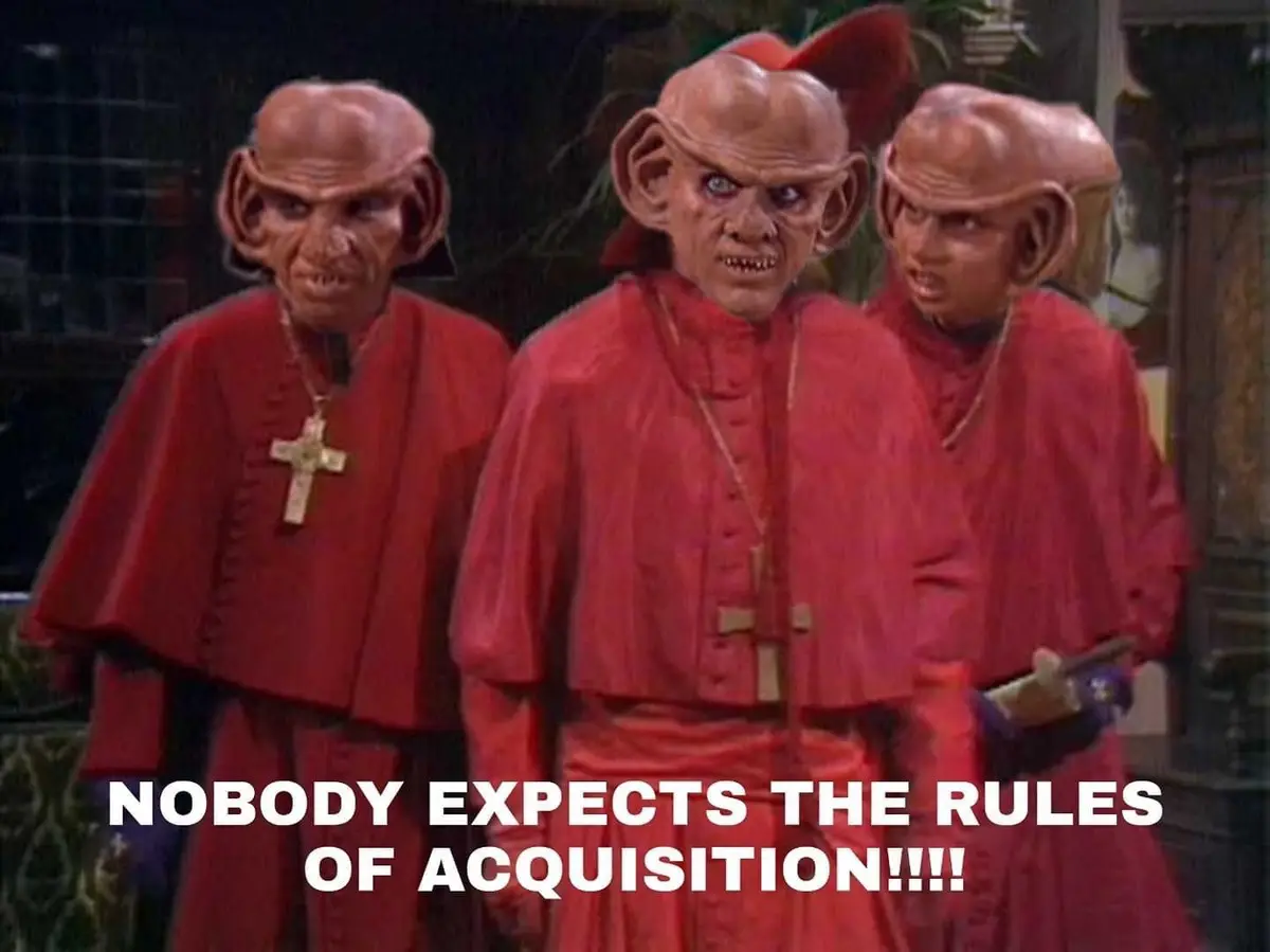 Three menacing, red-robed alien figures from Star Trek: The Next Generation stand in a row, their large ears and angry…