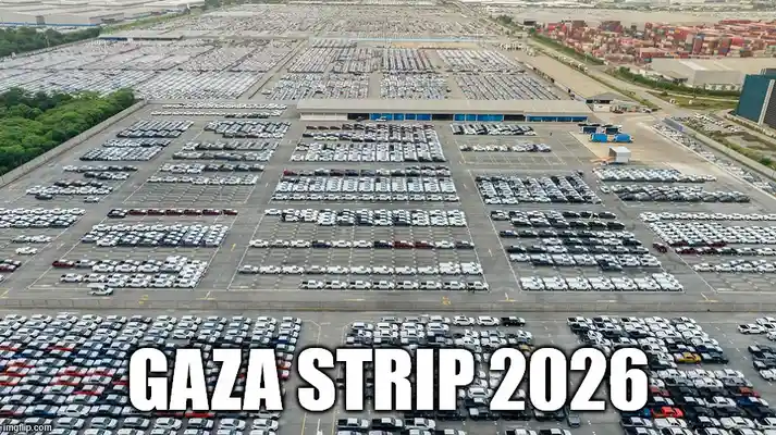 An aerial photo shows a massive, orderly parking lot filled with thousands of new cars, with shipping containers visible in…