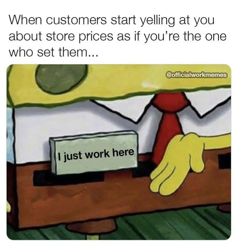 A cartoon image of SpongeBob SquarePants in a business suit with a red tie, standing behind a counter. His hand rests on the…