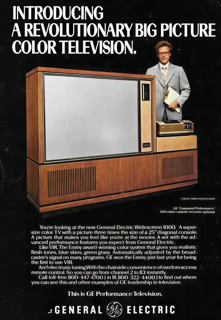 This vintage General Electric advertisement showcases a large, wood-grain console television with a blank screen, next to a…