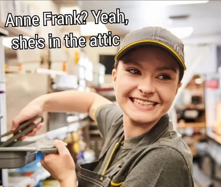 A smiling young woman wearing a McDonald's cap and uniform is holding a tray in what appears to be a fast-food kitchen. The…
