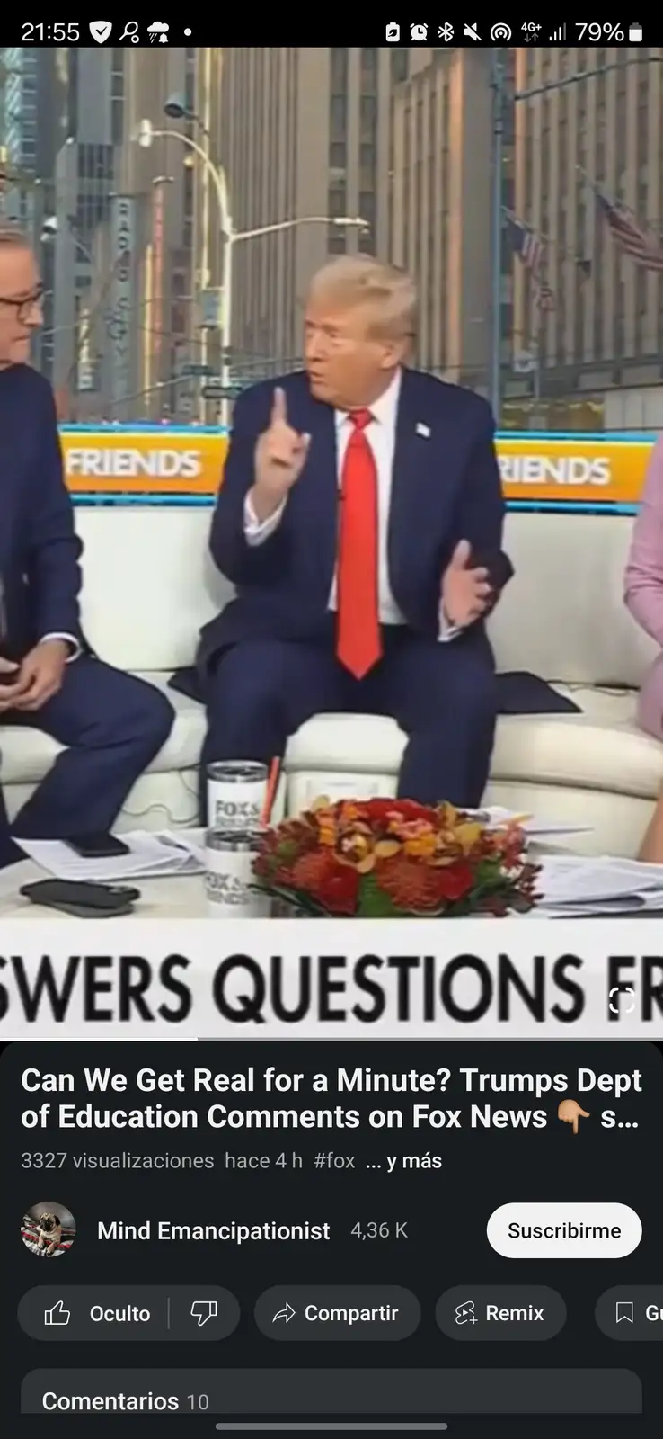 A still from a Fox News interview shows Donald Trump seated on a white couch, gesturing emphatically with his right index…