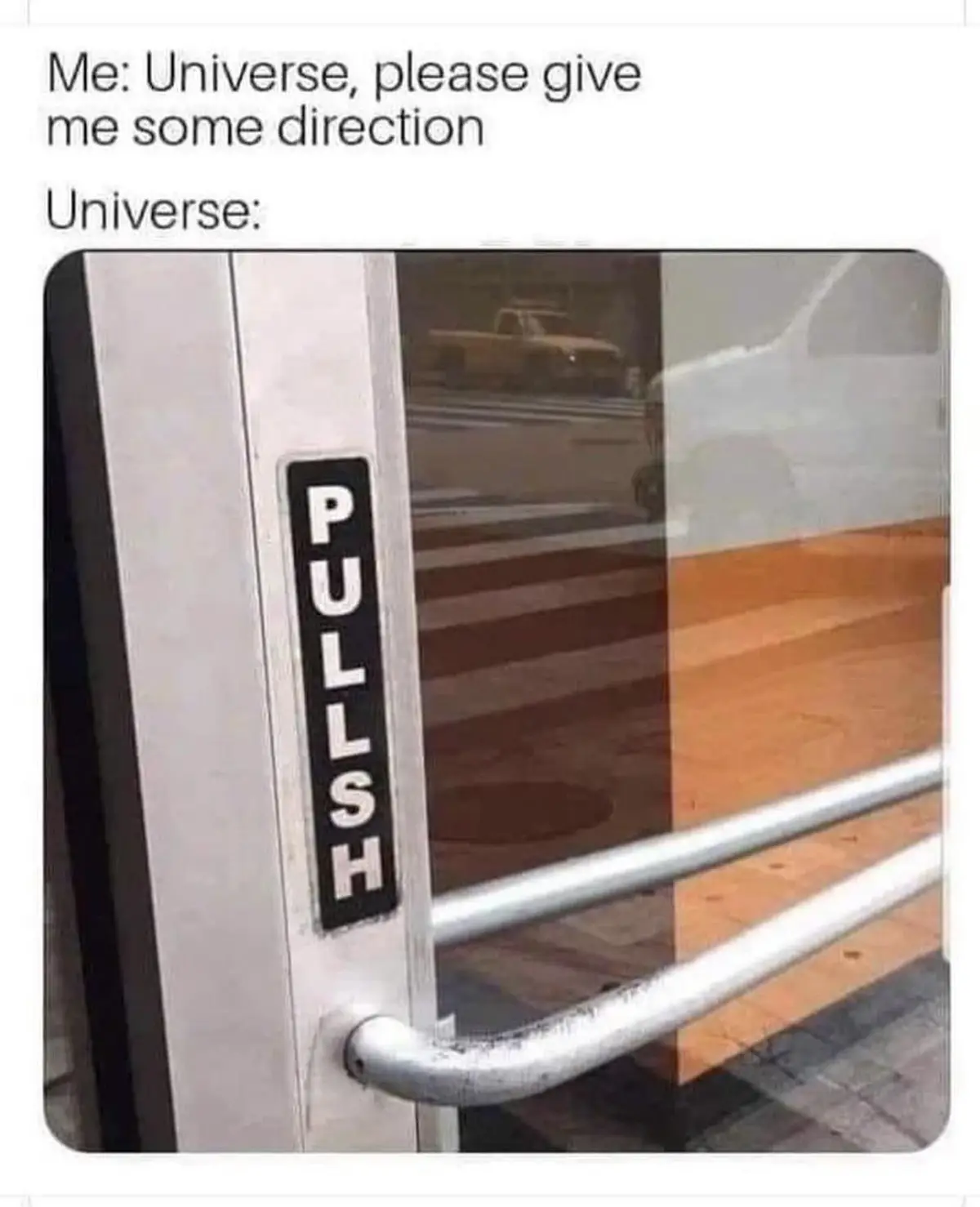 A close-up photo of a door with a vertical black sign that reads 'PULLSH' in white letters, which is a misspelling of…