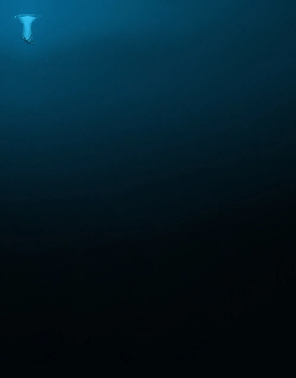A person is seen floating underwater near the surface, where light penetrates, while the rest of the image plunges into…