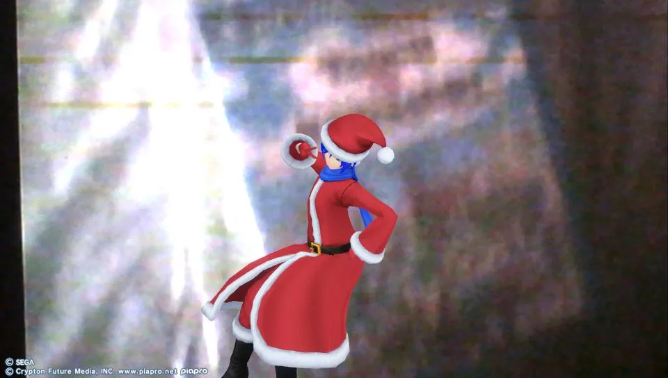 A video game character dressed in a red Santa Claus outfit with white trim and a matching hat, holding a megaphone to their…