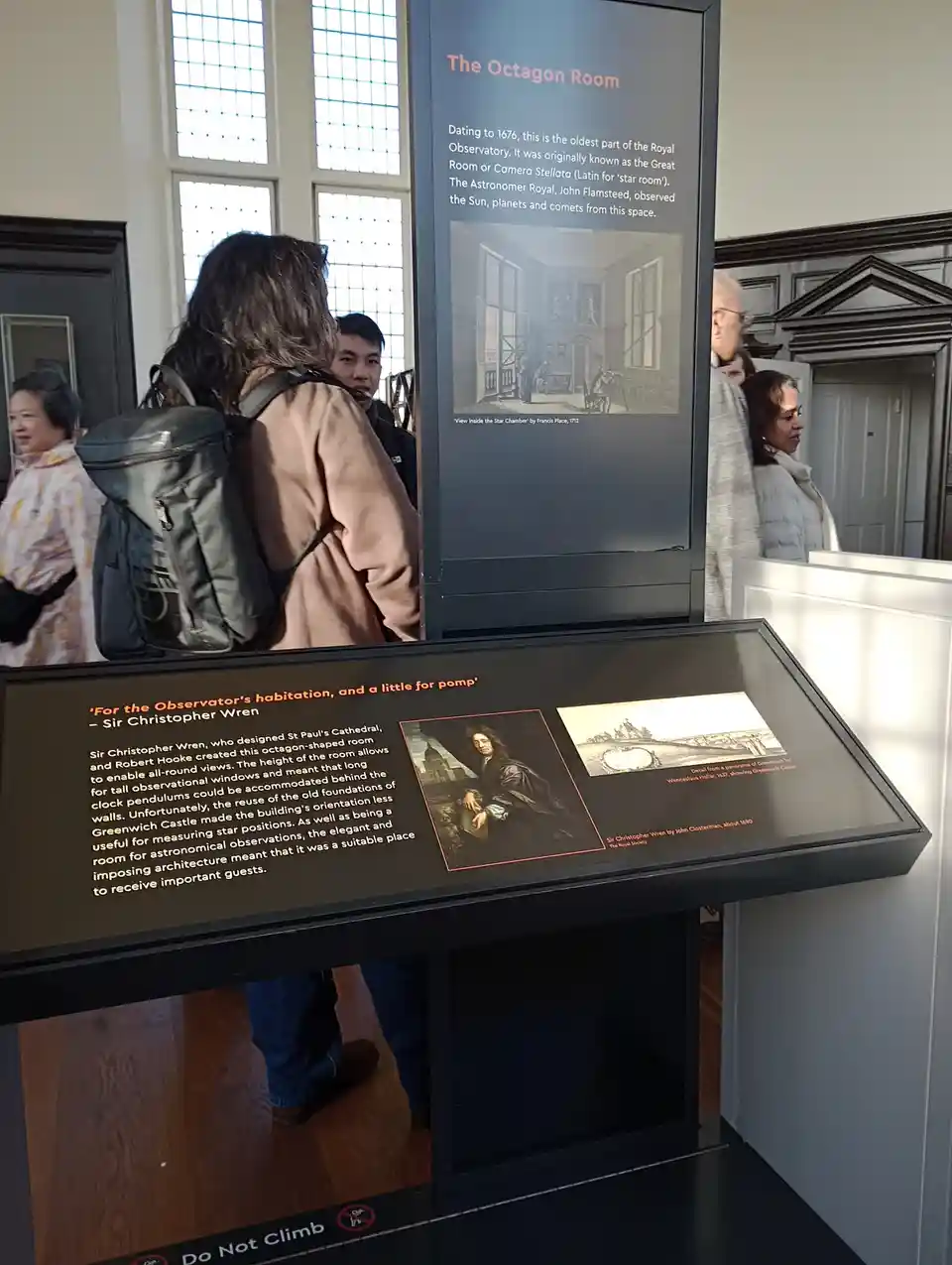 A museum exhibit at the Royal Observatory shows informational panels about 'The Octagon Room,' including a quote attributed…