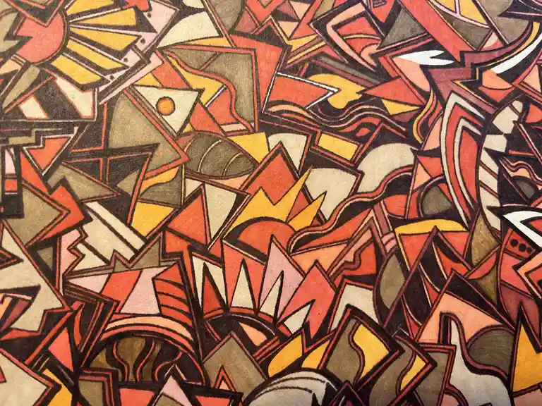 The image displays a dense, abstract artwork composed of overlapping geometric shapes like triangles, zigzags, and fan-like…
