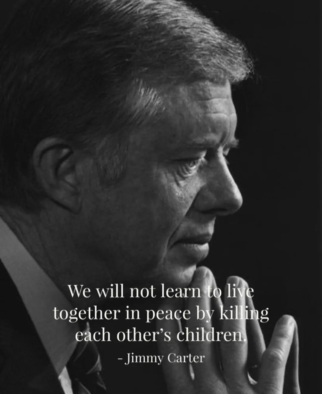 A black-and-white photo shows a solemn-looking Jimmy Carter in profile, his hand resting near his chin. Overlaid white text…