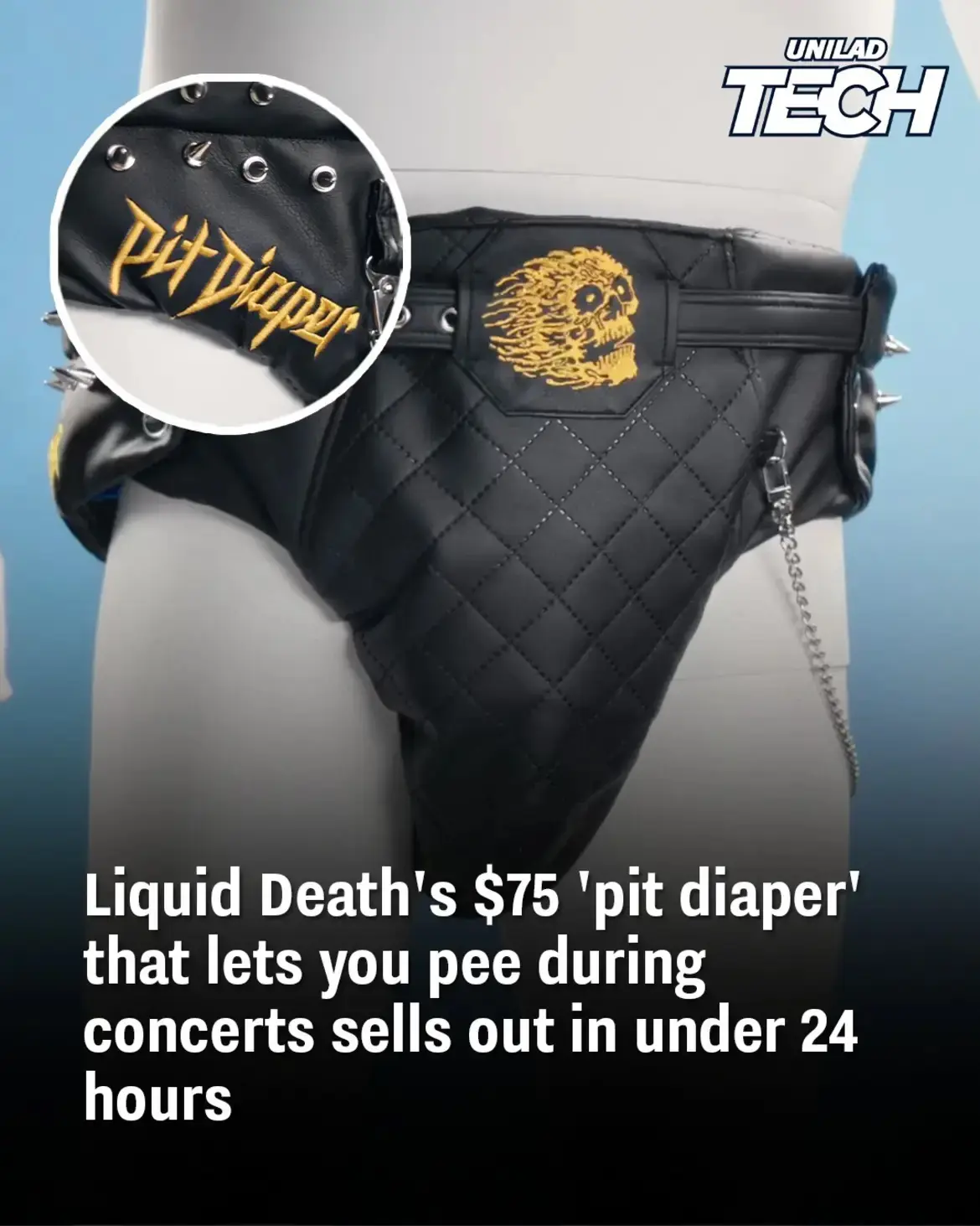 A black, quilted, studded 'pit diaper' with a yellow skull patch and 'Pit Diaper' embroidery is displayed on a mannequin. A…