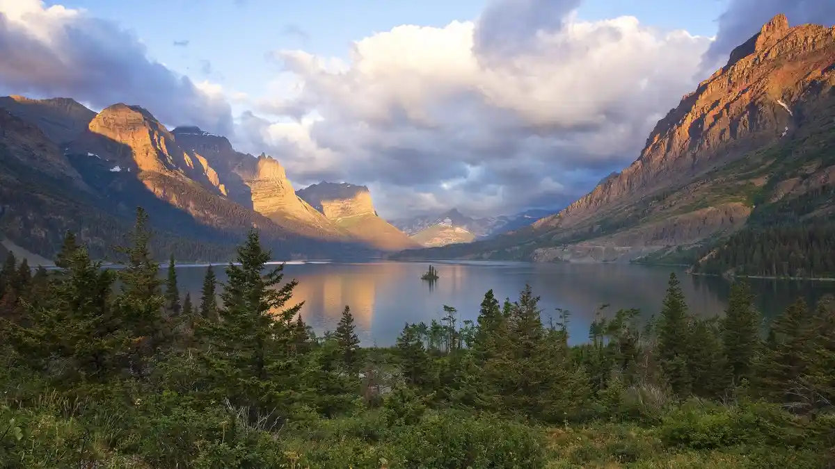 Saint Mary Lake in Glacier National Park forms a striking border between the Rocky Mountains and Great Plains. A tiny speck…