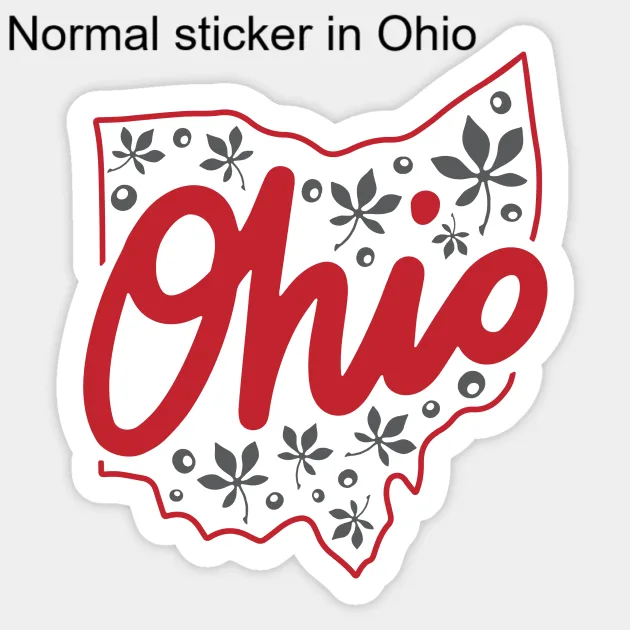 A white sticker shaped like the state of Ohio with a red outline and the word 'Ohio' in large red cursive lettering. Gray…