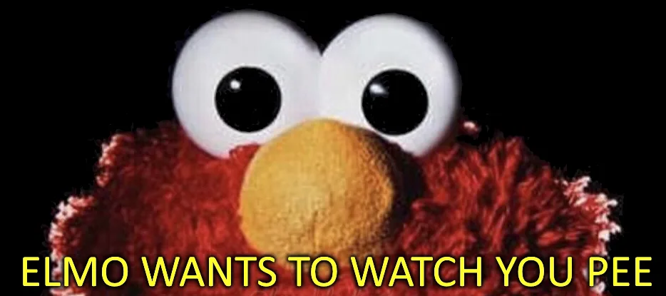 A close-up image of the red, furry Sesame Street character Elmo against a black background, with large white eyes and a…