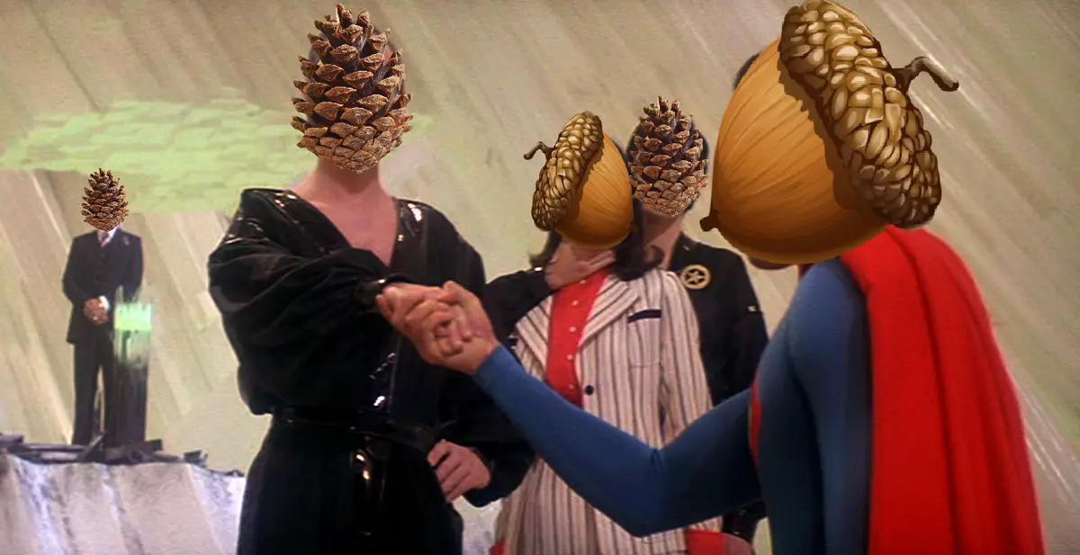 A still from a movie shows several people with their heads replaced by pinecones and acorns. One person in a blue and red…