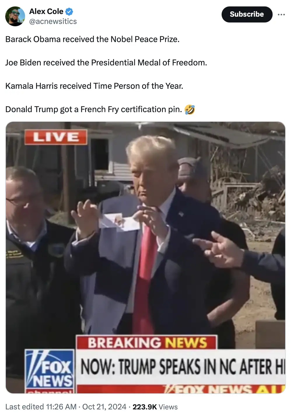 A screenshot of a Fox News broadcast shows Donald Trump holding up a small pin while speaking outdoors. The image is…
