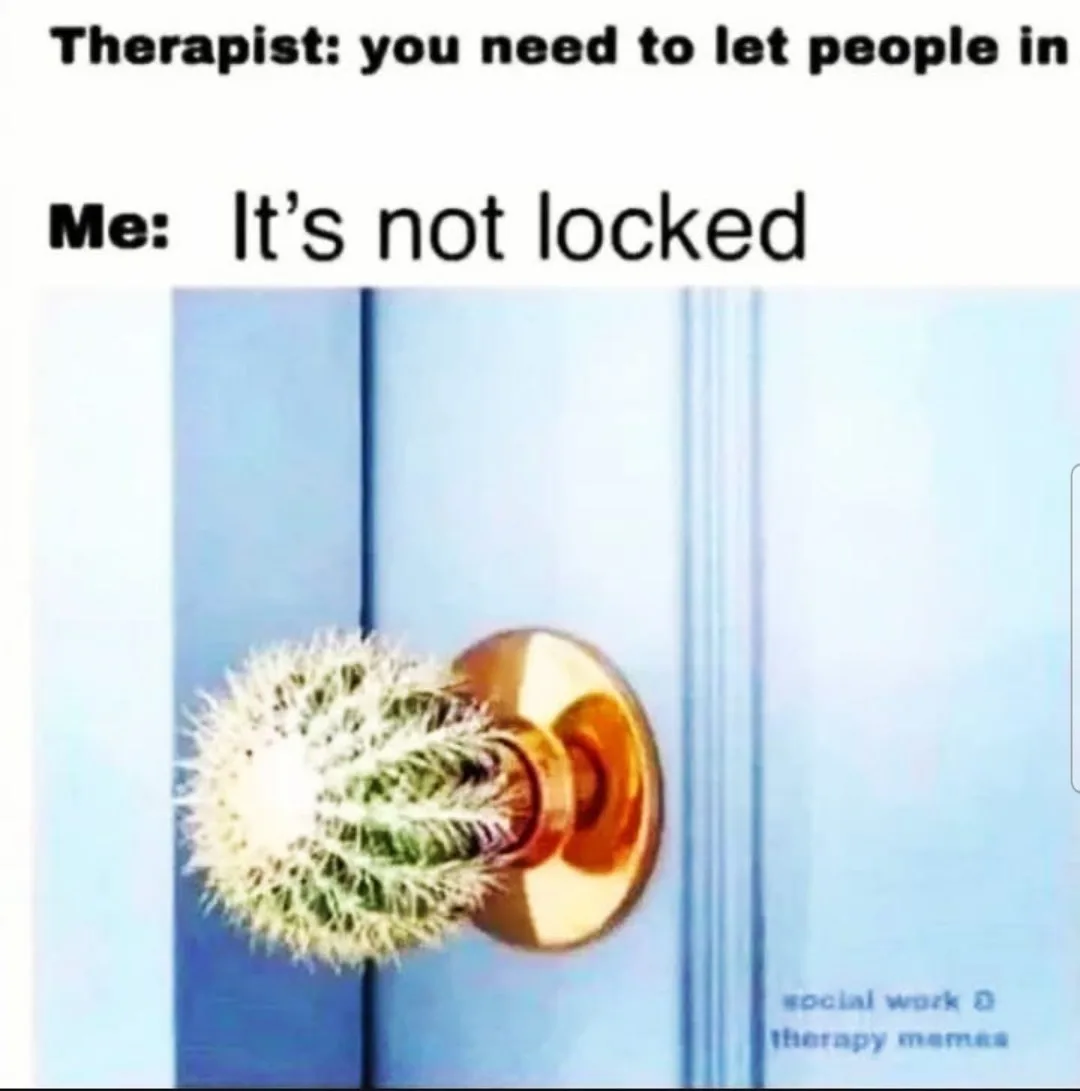 A light blue door has a golden doorknob, but instead of a handle, it's replaced with a spiky, spherical cactus. The overlaid…