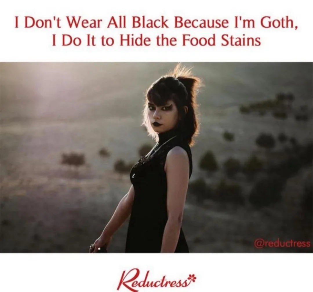 A woman with dark makeup and a black dress stands in a hazy outdoor setting. Red text at the top reads 'I Don't Wear All…