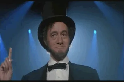 A man in a tuxedo and top hat is shown in six panels, transitioning from a smug expression to wide-eyed, arms-raised…