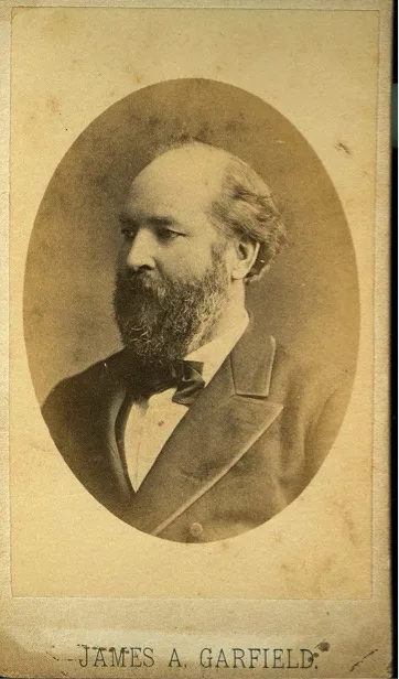 A sepia-toned, oval-framed vintage portrait of a bearded man in formal attire with a bow tie, identified by text at the…