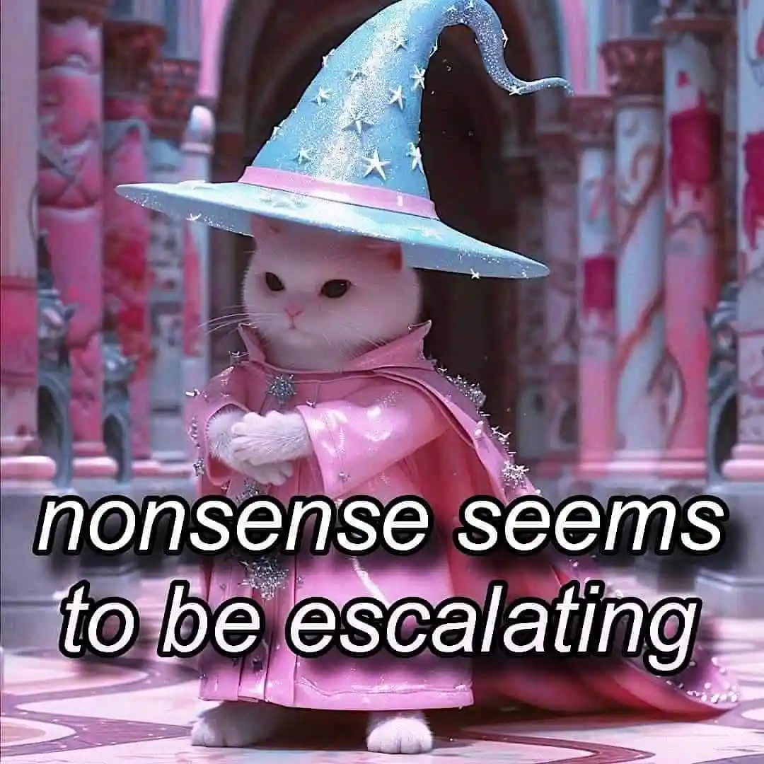 A white cat wearing a sparkly blue wizard hat with stars and a pink, glittery robe stands in a pink and purple fantasy…