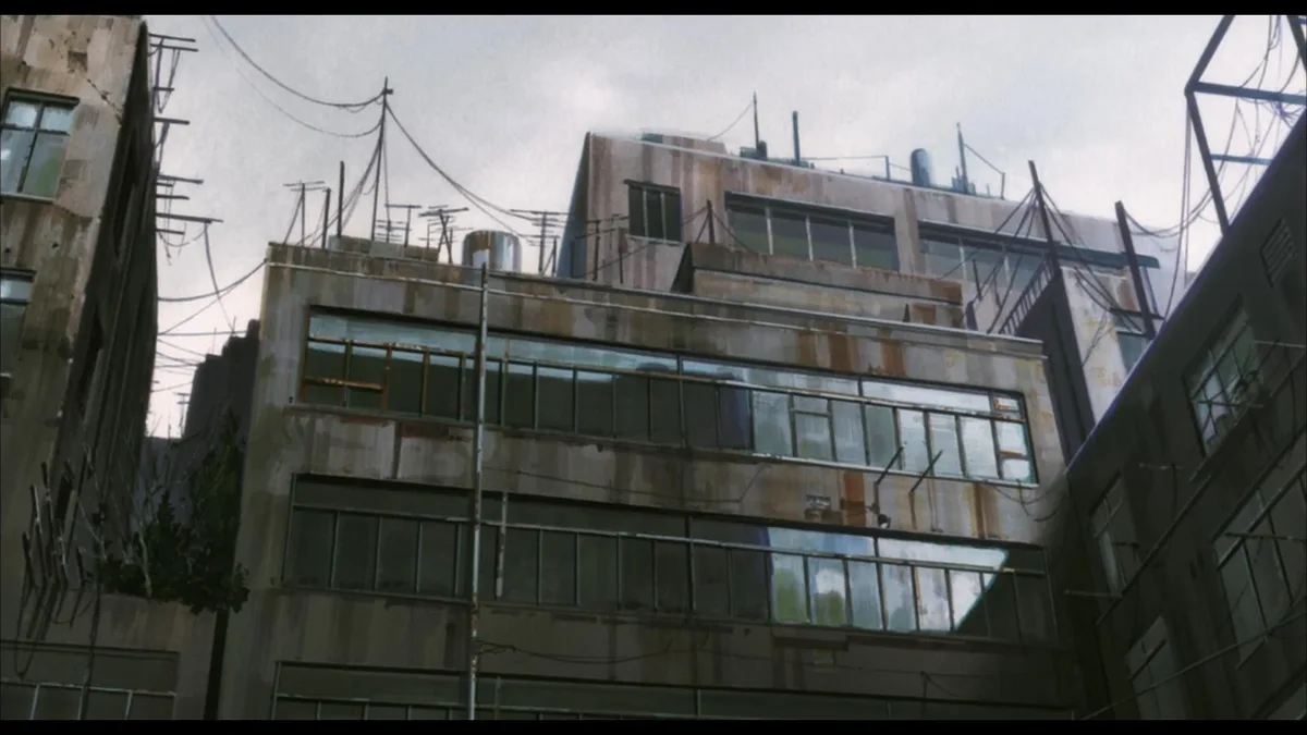 An anime-style image shows a weathered, multi-story building with rust stains, numerous windows, and tangled overhead wires…