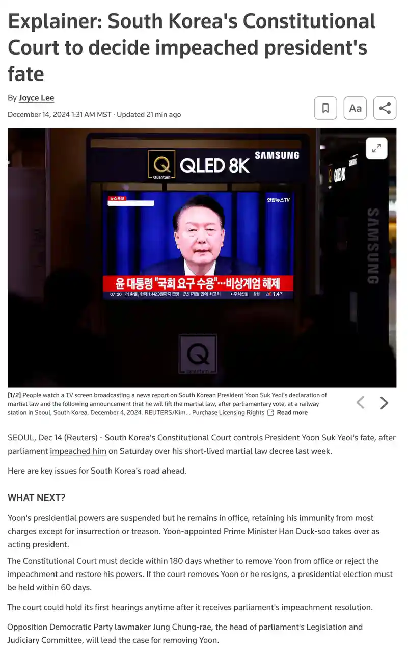 A Samsung QLED 8K TV screen displays a news broadcast featuring South Korean President Yoon Suk Yeol against a blue…