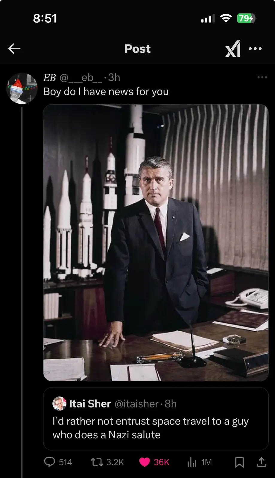A vintage photo shows a man in a dark suit standing behind a desk with rocket models in the background. The overlaid text…