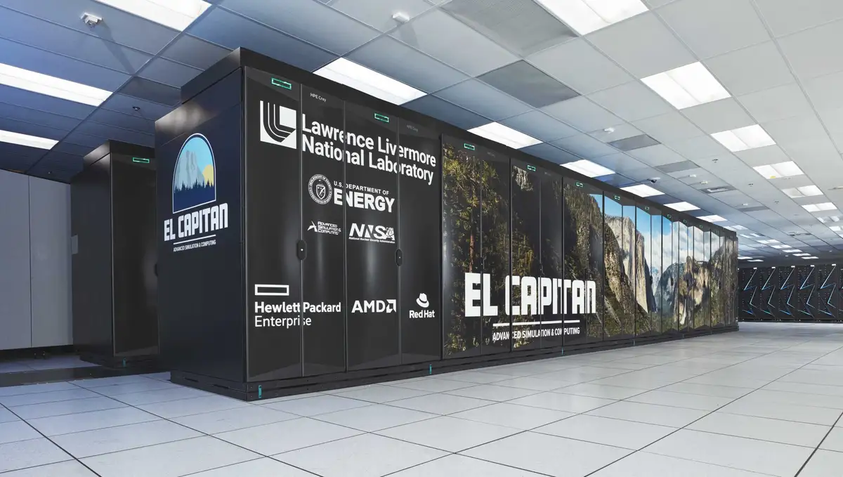 A row of large black supercomputer cabinets labeled 'El Capitan' with logos for Lawrence Livermore National Laboratory, U.S…