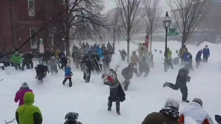 A six-panel image sequence shows a large crowd of people in winter clothing engaged in a chaotic snowball fight in a snowy…