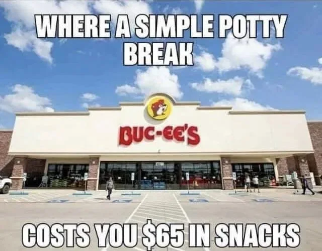 An exterior shot of a Buc-ee's gas station and convenience store under a blue sky with clouds. The store's large red logo is…