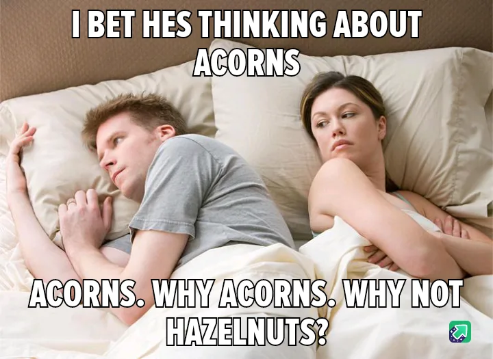 A man and woman are lying in bed, both looking away from each other with annoyed or unimpressed expressions. The man is on…