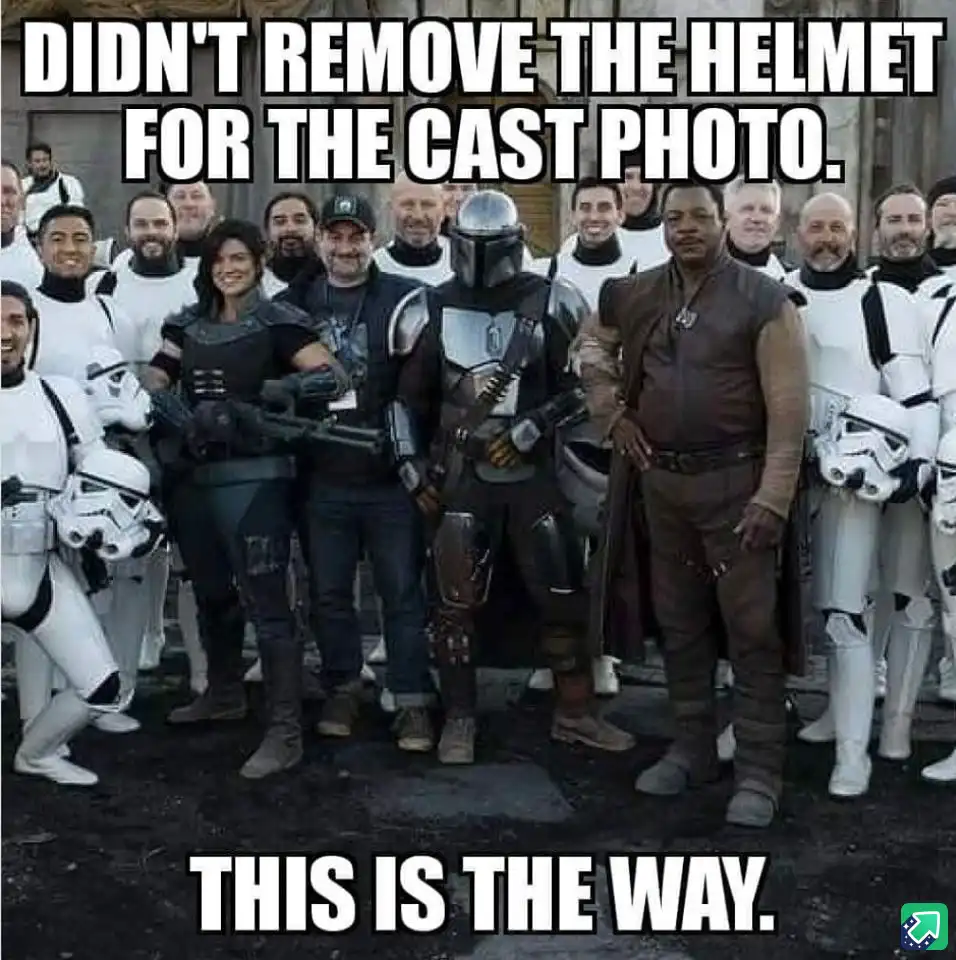 A group photo of the 'The Mandalorian' cast, including characters in full armor like the Mandalorian and Grogu, alongside…