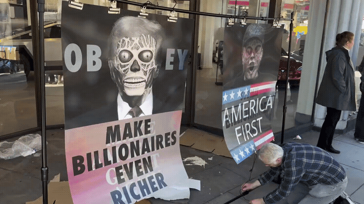 A person is seen kneeling on a sidewalk, methodically replacing political campaign signs featuring Donald Trump's face with…
