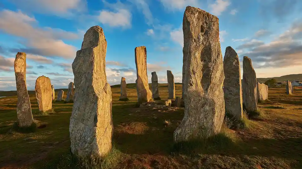 On Scotland's Isle of Lewis, the impressive Callanish Stones stand tall, forming a cross shape on the west coast. The…