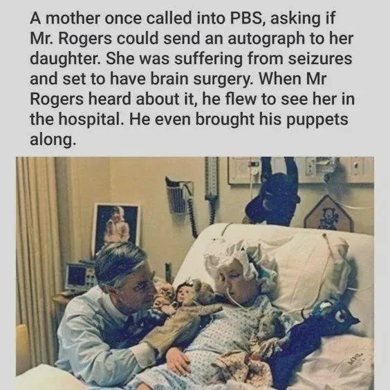 A vintage photo shows Mr. Rogers sitting beside a young girl in a hospital bed, holding her hand and looking at her with…