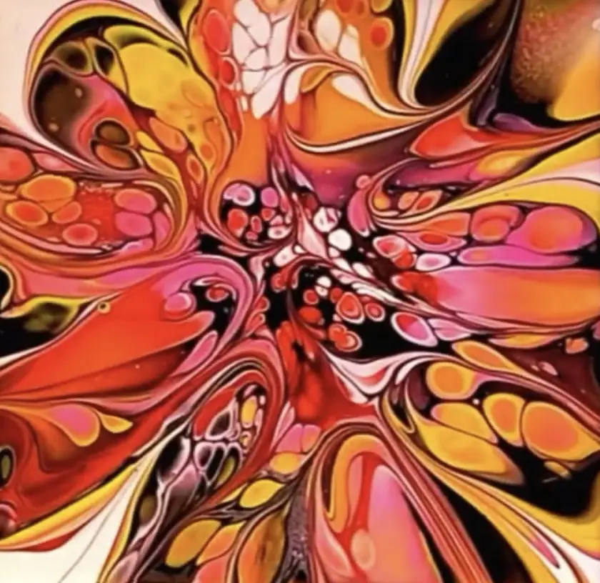A vibrant, swirling abstract painting with fluid, organic shapes in red, orange, yellow, pink, and black, resembling melted…