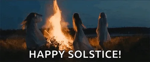 A six-panel image sequence shows three women in white dresses dancing around a large bonfire at dusk. The scene is repeated…