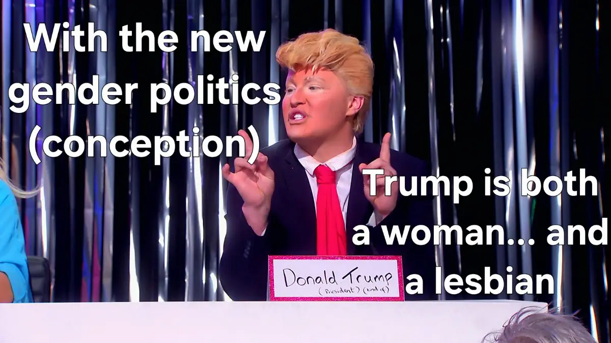 A person in a Donald Trump costume with blonde hair and red tie sits at a table with a nameplate reading 'Donald Trump…
