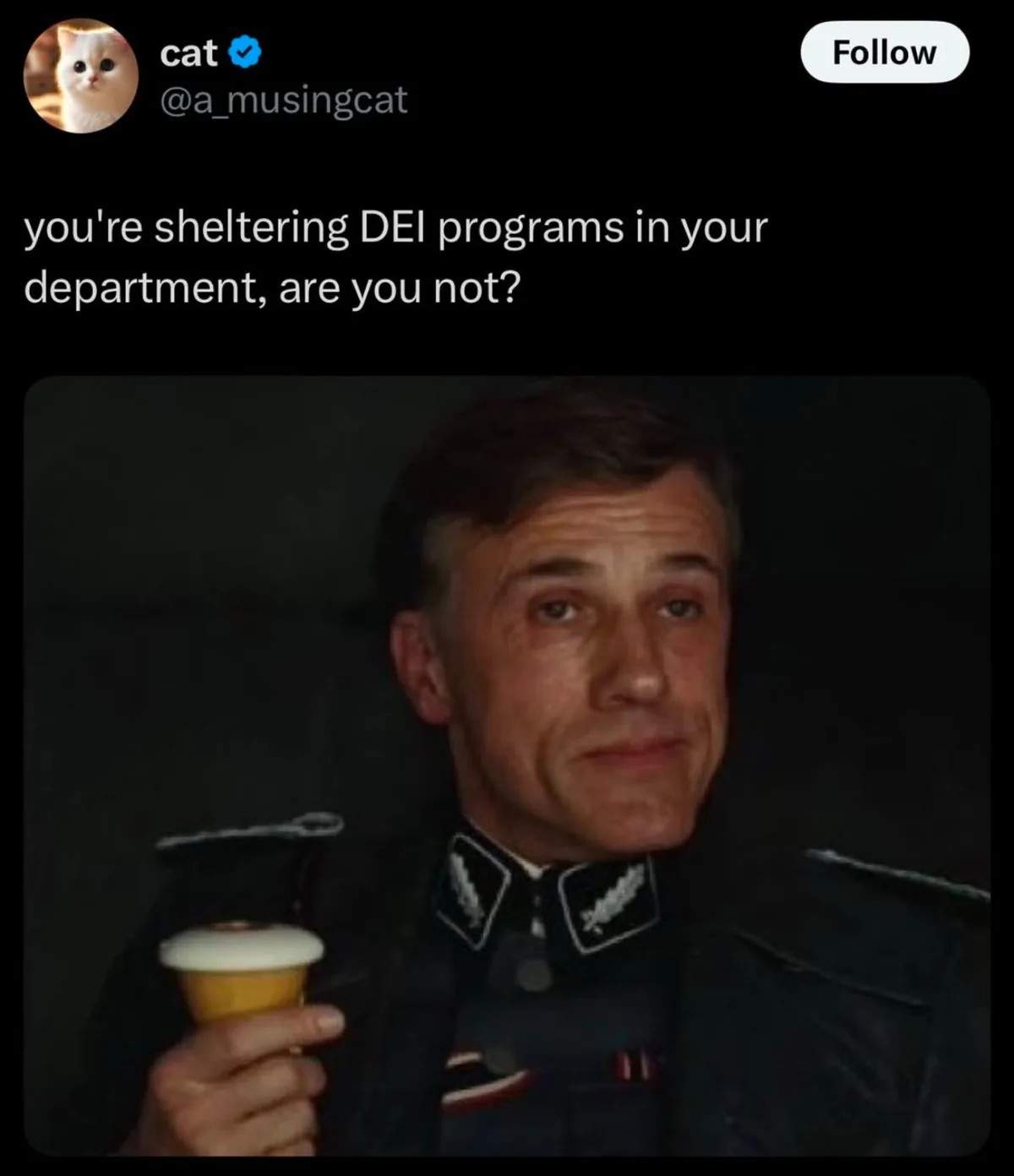 A screenshot of a tweet from a cat account shows a man in a dark uniform with insignia holding an ice cream cone, looking…