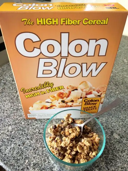 A cereal box labeled 'Colon Blow' with the tagline 'The HIGH Fiber Cereal' and 'Incredibly HIGH in FIBER' is shown behind a…