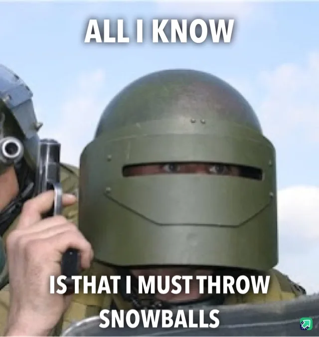 A person wearing a green, full-face combat helmet with narrow eye slits is shown holding a handgun, looking directly at the…